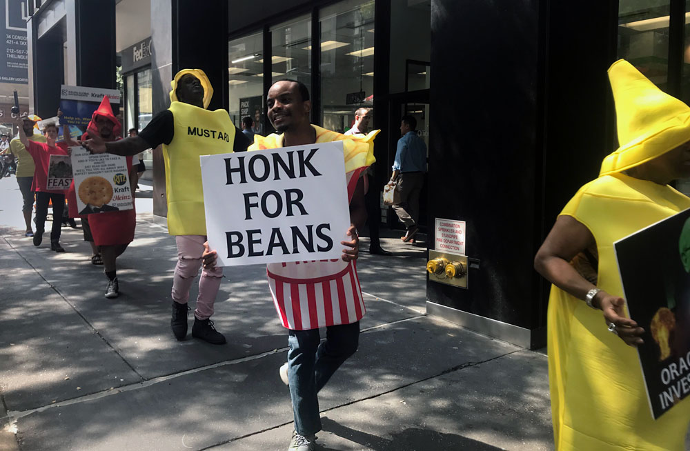 Why Men in Pickle Suits Are Outside Berkshire Hathaway and 3G Capital’s Offices